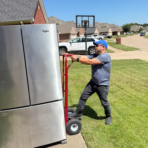 A repair technician proudly displaying their tools, representing expertise and readiness