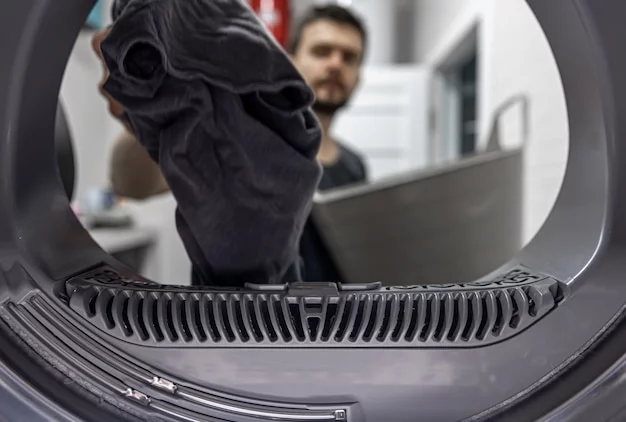 A technician working on a washing machine repair