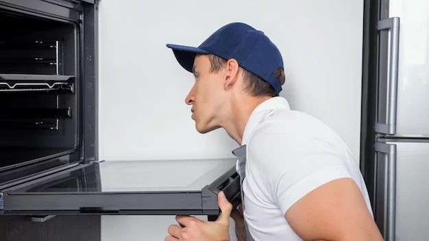 Oven repair being performed in a client's home